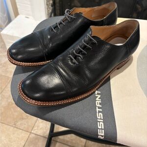 Maison Margiela black leather oxfords.